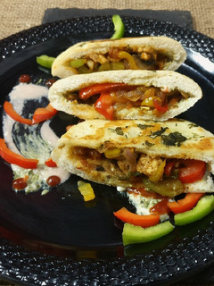 A picture of Shawarma filling in pita bread.