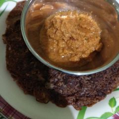 Ragi dosa with tomato, onion chutney A picture of Ragi dosa with tomato, onion chutney.