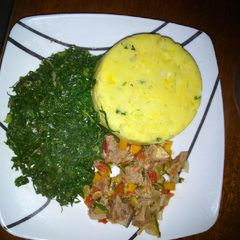 A picture of Mashed matoke, beef and greens.