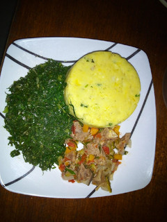 A picture of Mashed matoke, beef and greens.