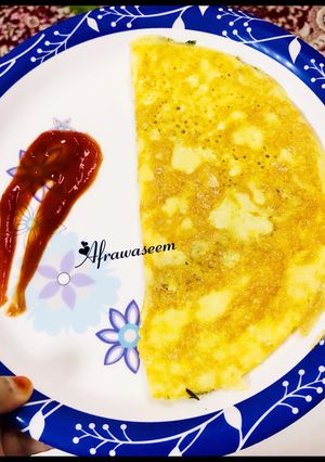 A picture of Soufflé omelette with dash of fenugreek leaves.