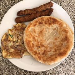 A picture of Seekh kabab,fried Egg & ready made paratha.