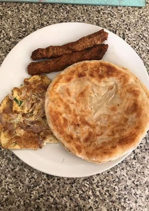 A picture of Seekh kabab,fried Egg & ready made paratha.