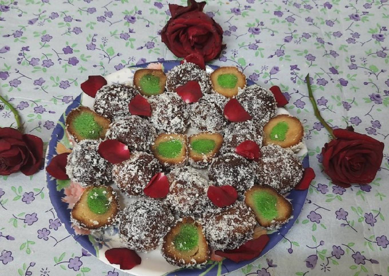 Stuff gulab jamun coated with dry coconut powder