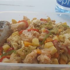 A picture of Irish potatoes with fish and vegetables.