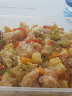 A picture of Irish potatoes with fish and vegetables.
