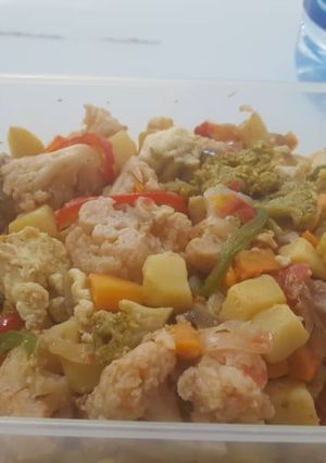 A picture of Irish potatoes with fish and vegetables.