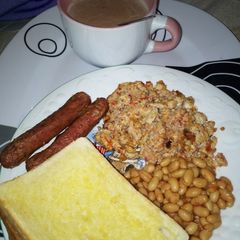 Toasted Bread, Egg with Sardine Sauce, Baked Beans with Sausage A picture of Toasted Bread, Egg with Sardine Sauce, Baked Beans with Sausage.