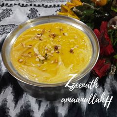 A picture of Aamras with Dry Fruits.