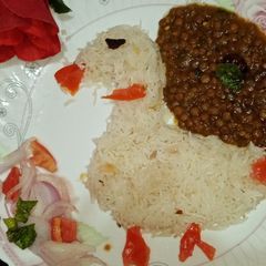 A picture of Kalay masoor ki Daal with zeera rice.