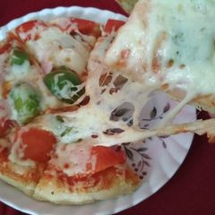 Extra cheesy pizza without oven / without yeast. Ramadan special A picture of Extra cheesy pizza without oven / without yeast. Ramadan special.