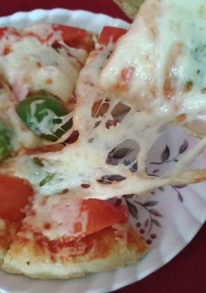 A picture of Extra cheesy pizza without oven / without yeast. Ramadan special.