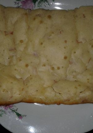 Una foto de Torta de queso rallado, con paleta picada