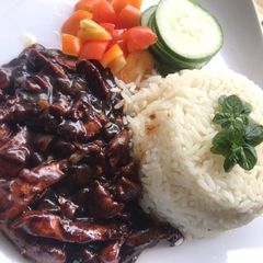 A picture of Mint rice and teriyaki sauce.