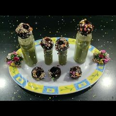 A picture of Chocolate golgappa with paan shots.