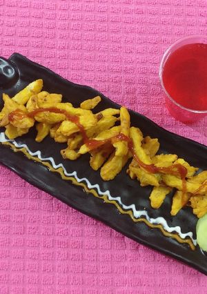 A picture of French fries in gram flour & cheese.