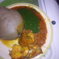 A picture of Amala, ewedu& catfish stew.