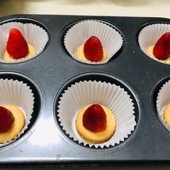 A picture of Strawberry short cupcake with strawberry ice cream frosting.