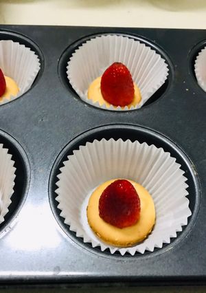 A picture of Strawberry short cupcake with strawberry ice cream frosting.