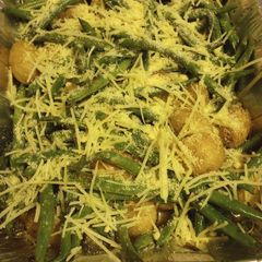 A picture of Potatoes and Green Beans with Parmesan Cheese.