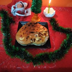 A picture of Christmas special heart shape eggless plum cake.