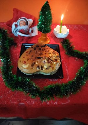 A picture of Christmas special heart shape eggless plum cake.