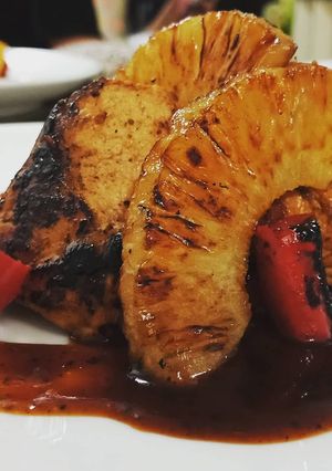 A picture of Pan seared Chicken amd pineapple.