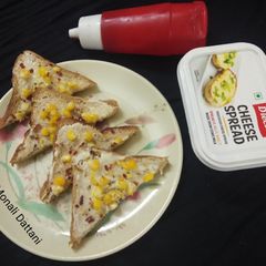 A picture of Cheese corn open toast.