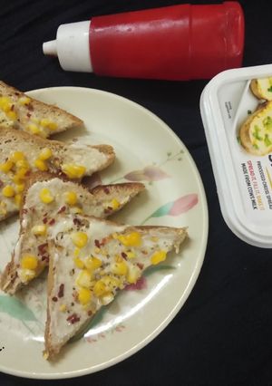 A picture of Cheese corn open toast.