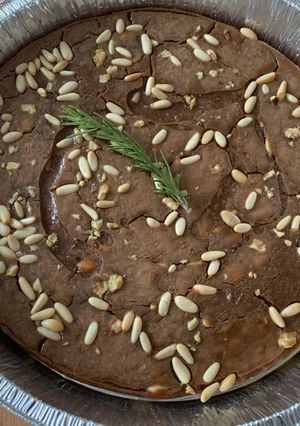 A picture of Castagnaccio with Pine Nuts and Walnuts.