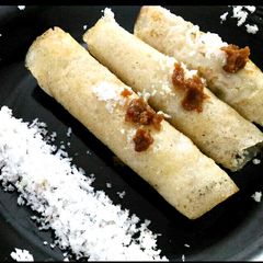 A picture of Banana and rice powder pancake with coconut.