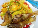 Garnished rice with fried chicken