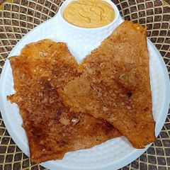A picture of Schezwan Onion Rava Dosa With Schezwan Coconut Chutney.