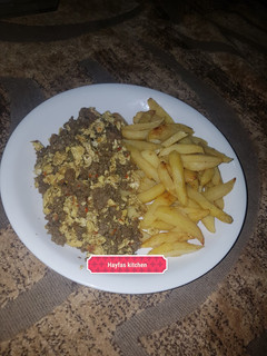 A picture of Fried irish potatoes with minced meat and egg sauce.