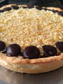 Una foto de Torta de coco y dulce de leche chocolatado