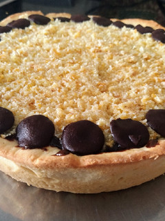 Una foto de Torta de coco y dulce de leche chocolatado