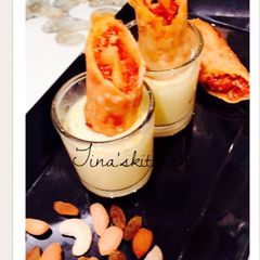A picture of Shahi gajrela spring rolls in rabdi sauce.