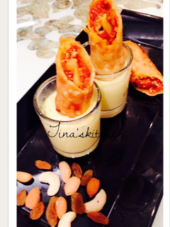 A picture of Shahi gajrela spring rolls in rabdi sauce.