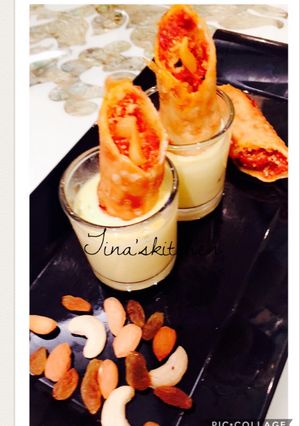 A picture of Shahi gajrela spring rolls in rabdi sauce.