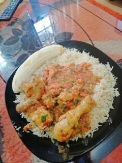 A picture of Fried rice with chicken curry.
