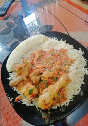 A picture of Fried rice with chicken curry.