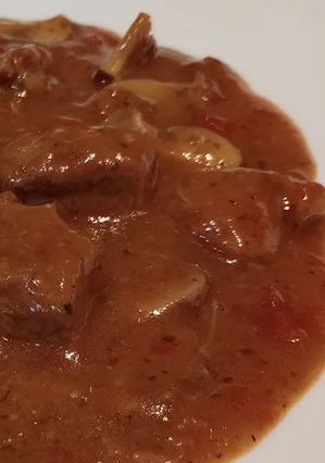 Una foto de Guiso de Secreto Ibérico de Cerdo a la Cerveza con Portobellos