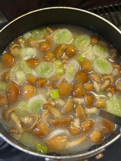 A picture of Miso Soup with Nameko Mushrooms and Green Onions.