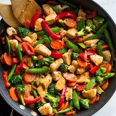 A picture of Stir Fry Chicken with Mashed Potatoes.