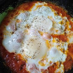 Homemade tomato sauce and eggs A picture of Homemade tomato sauce and eggs.