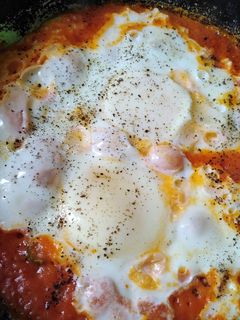 A picture of Homemade tomato sauce and eggs.