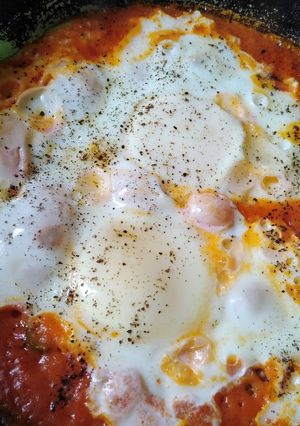 A picture of Homemade tomato sauce and eggs.