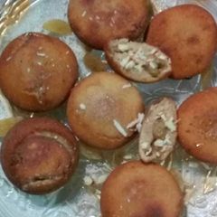 A picture of Rice Fritter stuff with mava mishri and nuts.