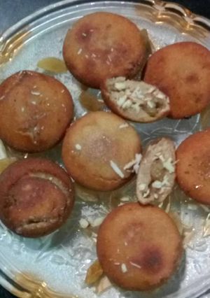 A picture of Rice Fritter stuff with mava mishri and nuts.