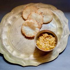 A picture of Murauri or Radish / Mooli Rice flour Kachori with Radish Tomato Chutney.